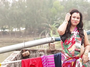 Watch this Indian beauty with a stunning figure take it hard in rear end fashion on the rooftop