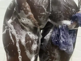 Brief-haired Nigerian hottie gets drenching humid with gusto in a red-hot shower
