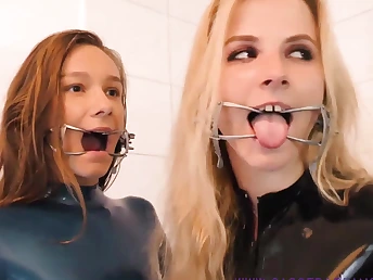 A handful of horny babes wearing latex and lofty heels multitude away prevalent a nasty way